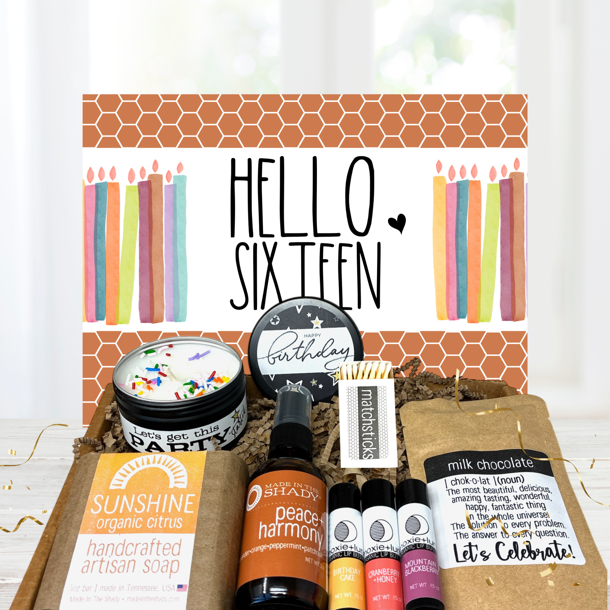 Sweet 16 birthday Gift set with candles, soap, and other items on a white background