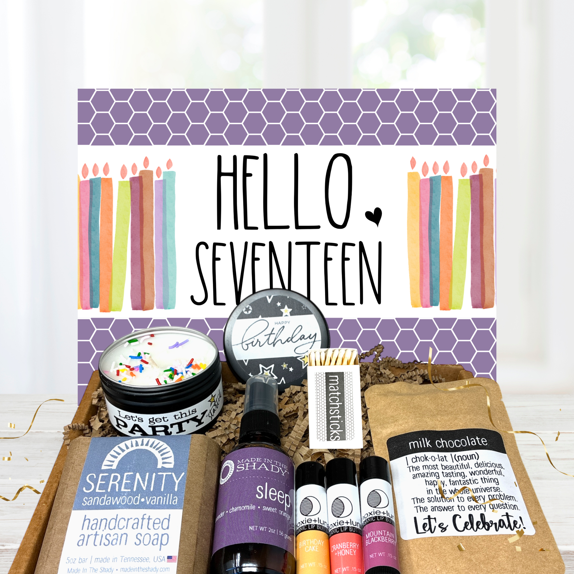 Seventeen year old Birthday gift set with candles, soap, and other items on a white background